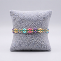 Charmed Meadow Chain – Woven Pastel Flower Seed Bead Pull-String Bracelet⁠